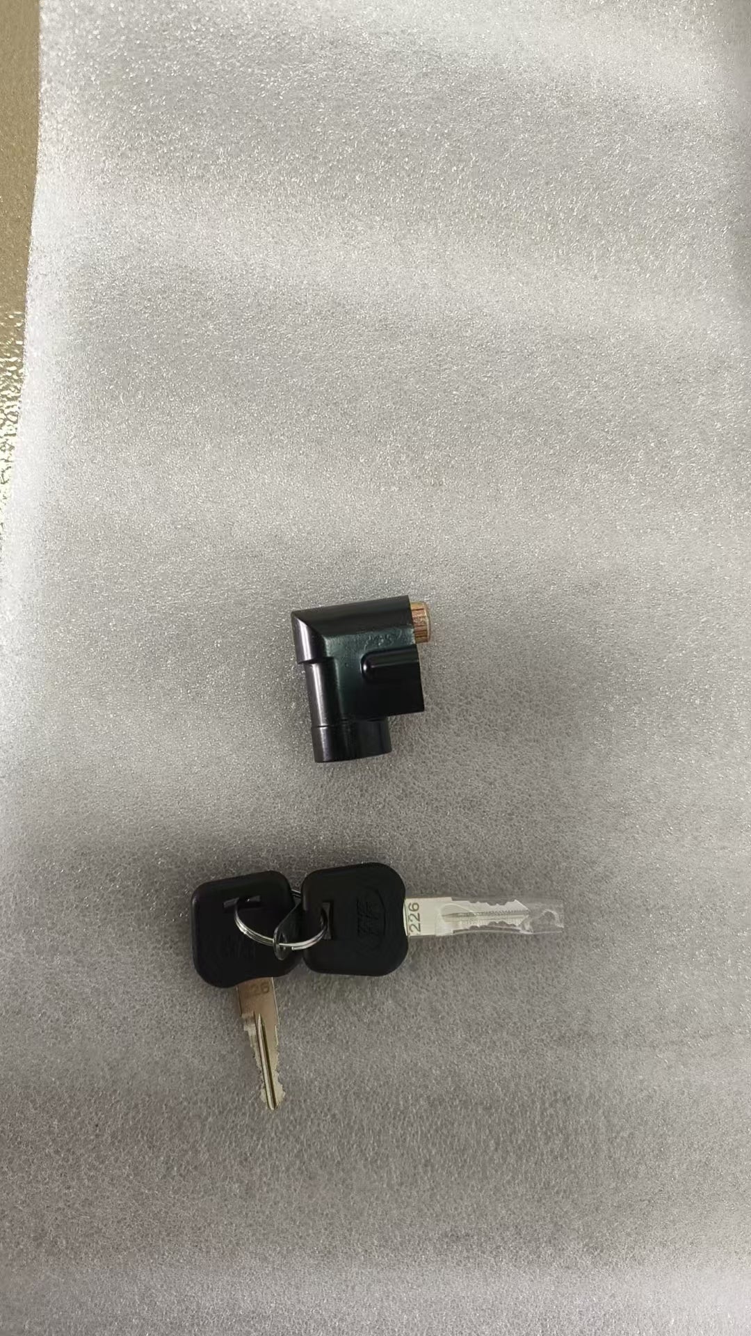 Battery cover and key pair